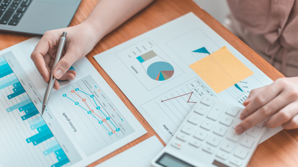 Accountant Calculating Statistic Reports